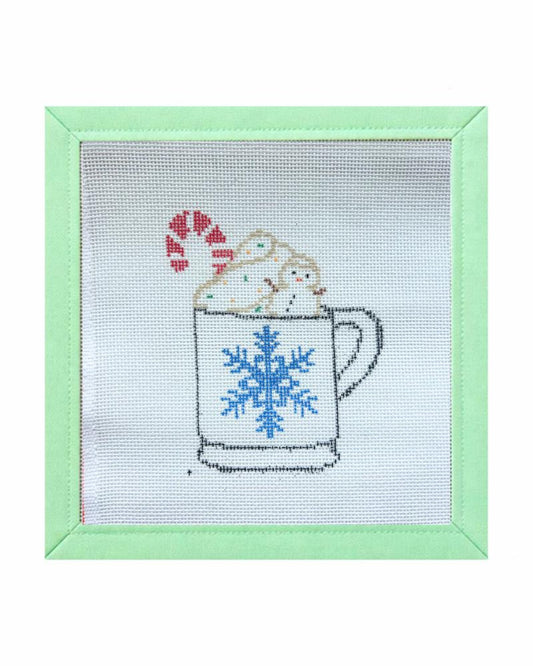 Hand-painted hot chocolate mug with snowman needlepoint canvas with a blue snowflake on the mug and winter characters.